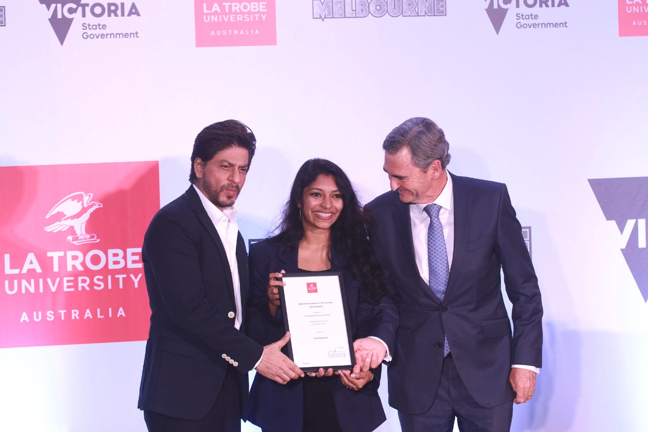 Shah Rukh Khan Awards the Ph.D. scholarship named after him to a girl from Kerala at a special event hosted by the Indian Film Festival of Melbourne
