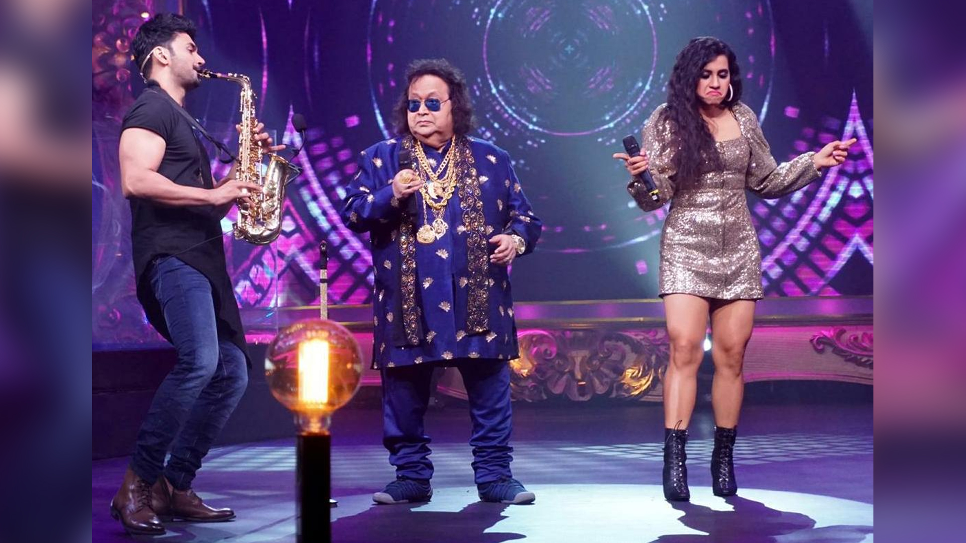 RJ Anmo takes Hosting on Indian TV a Notch Up, plays Solo Saxophone on Jammin & Shocks Bappi da