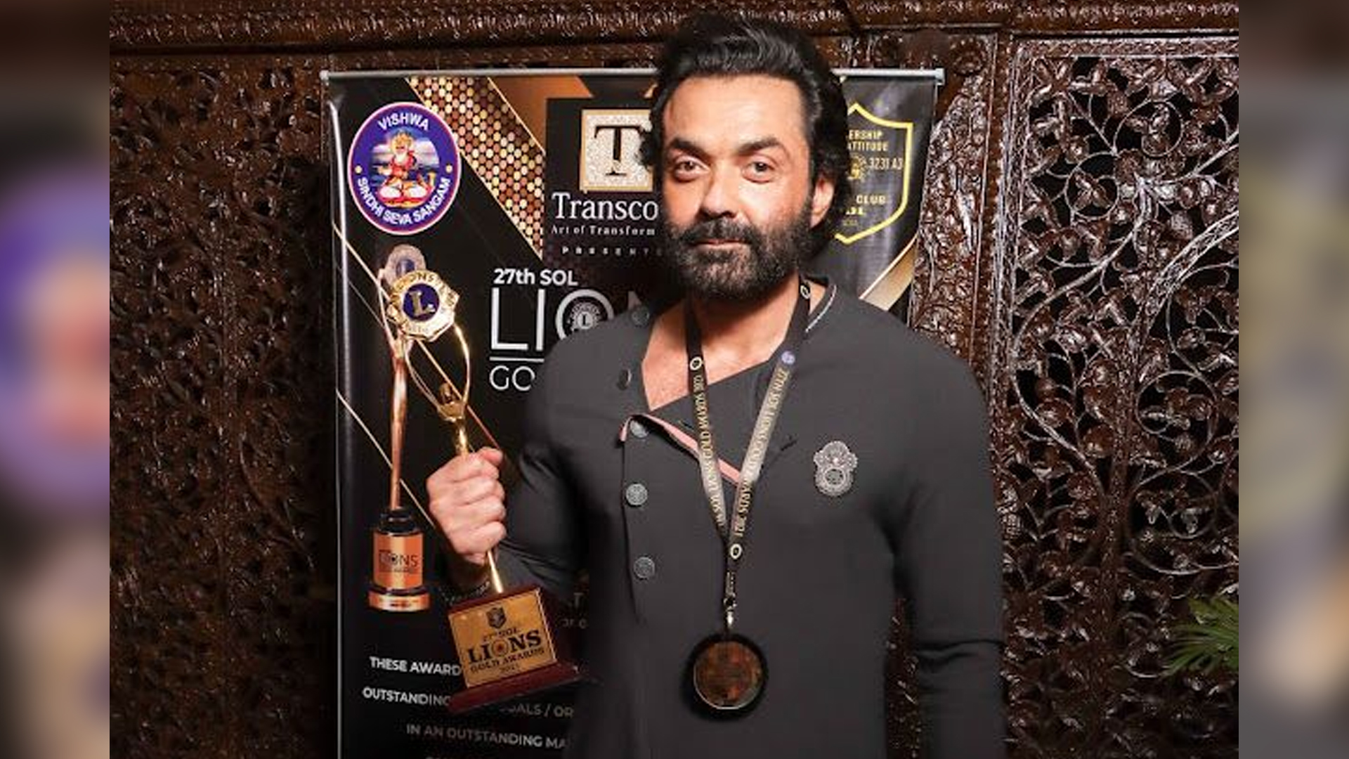 Bobby Deol felicitated with the award for Best Actor OTT Star for Aashram by Governer of Maharashtra Bhagat Singh Koshyari at the 27th Lions Gold Awards 2021.