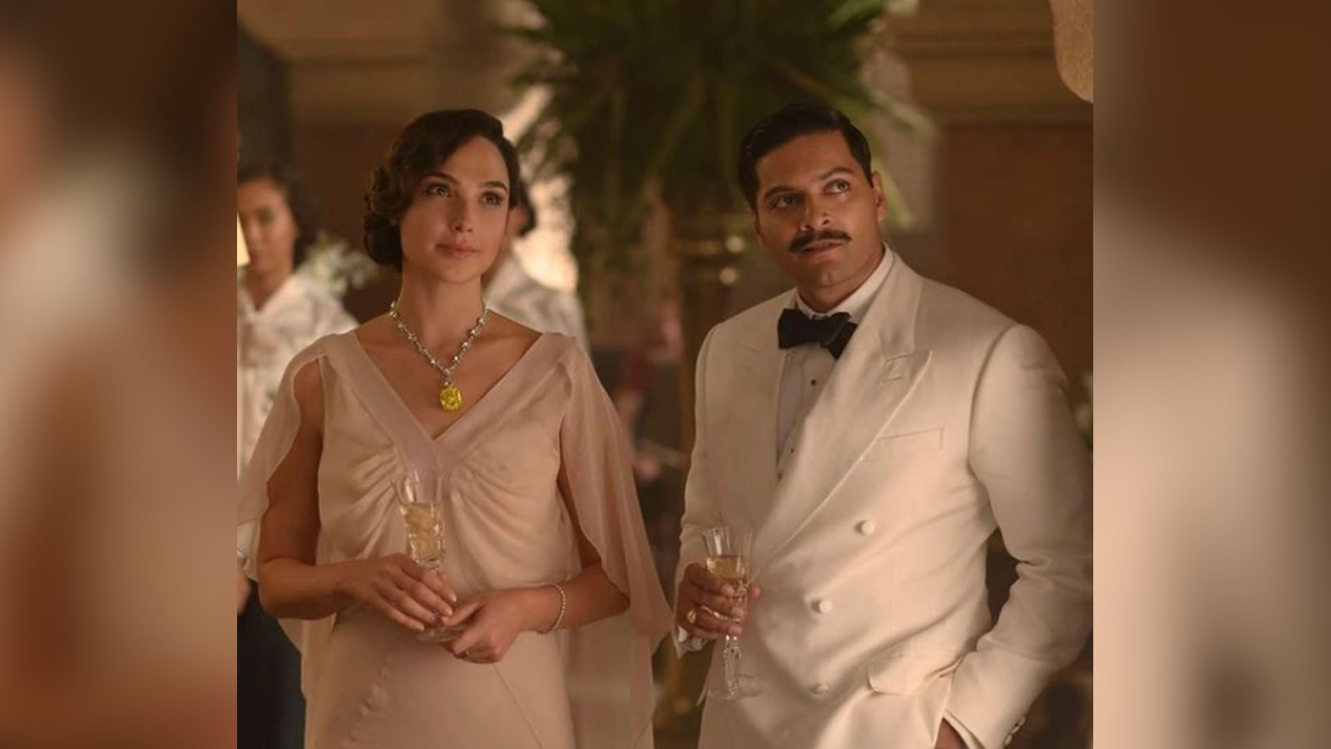 Two New Promos give us more details of Ali Fazal’s role in Death On The Nile with Gal Gadot’s character having faith in him