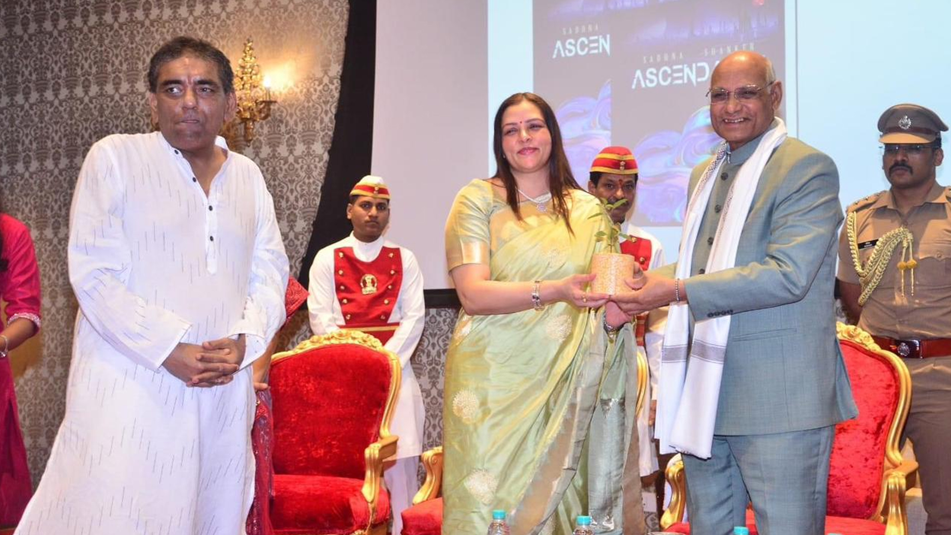 Ms Nidarshana Gowani gifts Tulsi sapling to the Governor of Maharashtra at an event on Earth Day